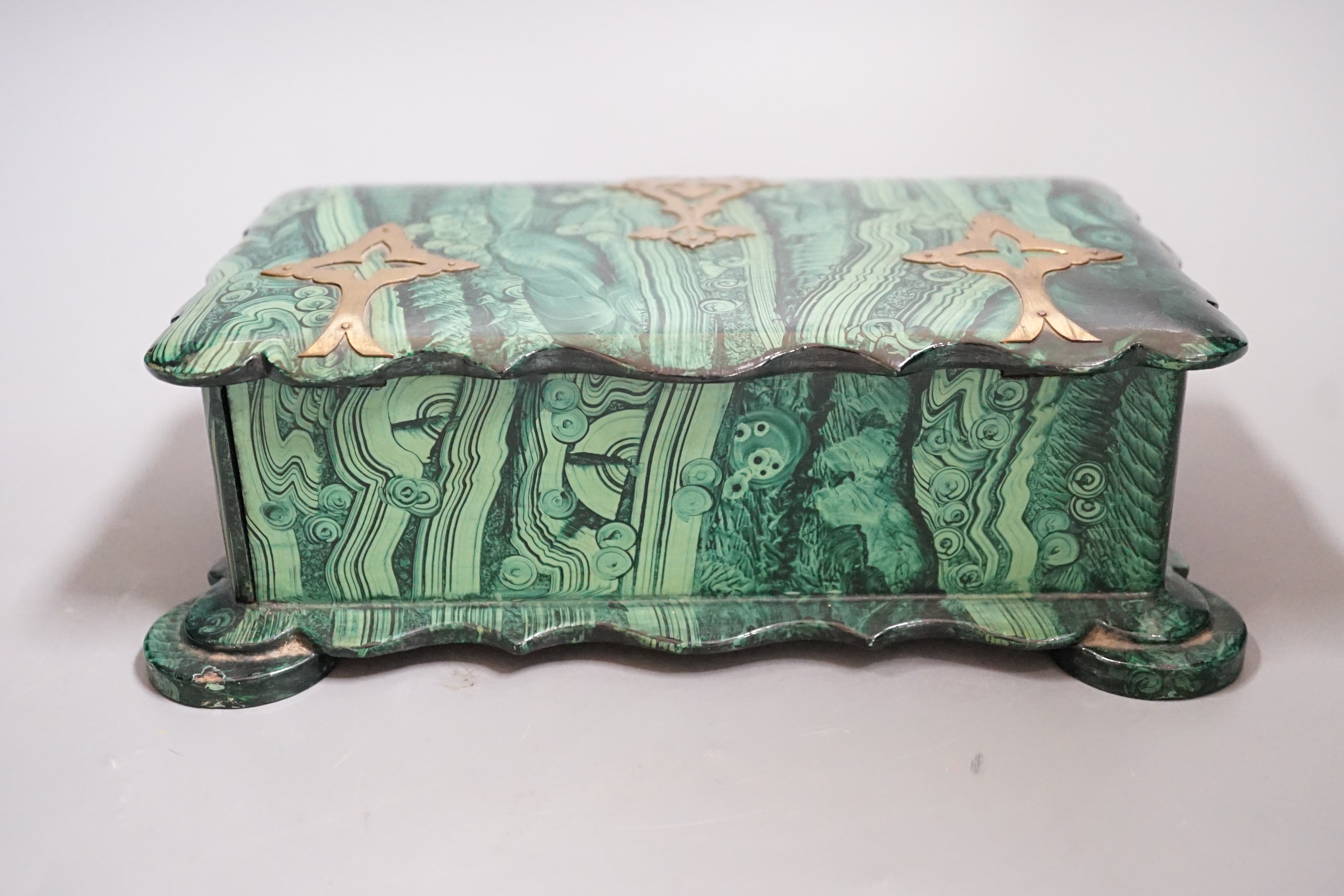 A Victorian papier-mâché-mache faux malachite, brass mounted jewellery box, 21cms wide x 12.5cms deep
